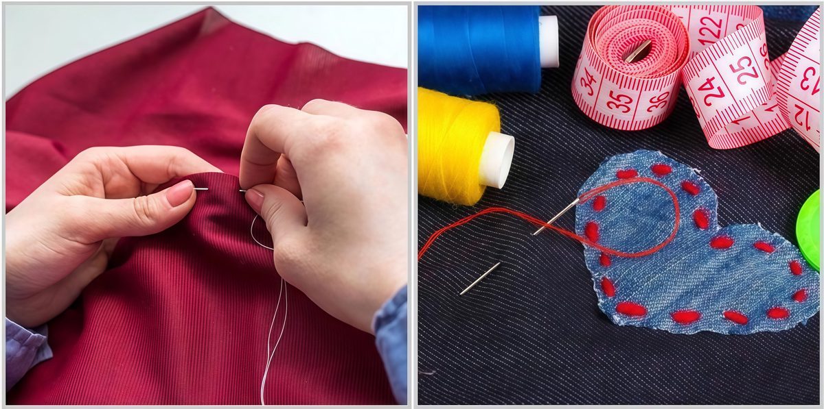 A hand pulling a large eye sewing needle through a cream-colored linen shirt, making small even stitches to mend a split seam, with a transparent needle tube and two threaders resting on a wooden table nearby.
